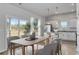 Light-filled dining area with sliding glass doors and views of the natural landscape provides seating for six at 491 Wagner Cir., Conway, SC 29526