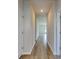 Hallway features wood-look floors leading to a bright living area with natural light at 491 Wagner Cir., Conway, SC 29526