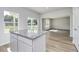 Kitchen island with granite countertops and sliding glass doors to backyard at 491 Wagner Cir., Conway, SC 29526