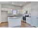 The kitchen features white cabinetry, stainless steel appliances, and a center island with granite countertops at 491 Wagner Cir., Conway, SC 29526