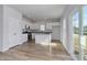 Modern kitchen with white cabinets, stainless appliances, and eat-in island at 491 Wagner Cir., Conway, SC 29526