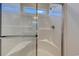 Modern glass-enclosed shower with a built-in seat and a window for natural light at 491 Wagner Cir., Conway, SC 29526