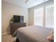 Bedroom with dresser, tv, and sunny windows at 511 Rose Fountain Dr., Myrtle Beach, SC 29579