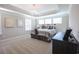 Cozy bedroom featuring tray ceilings, plush carpeting and three large windows for ample natural light at 511 Rose Fountain Dr., Myrtle Beach, SC 29579