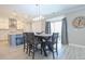 Dining area with a modern table, stylish chairs, and sliding glass doors to the patio at 511 Rose Fountain Dr., Myrtle Beach, SC 29579