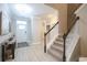 Hallway featuring stairs to the second floor and a light colored resilient floor at 511 Rose Fountain Dr., Myrtle Beach, SC 29579