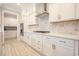 Modern kitchen with white cabinets, stainless steel appliances, and a stylish backsplash at 511 Rose Fountain Dr., Myrtle Beach, SC 29579