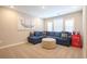 Comfortable living room with a blue sectional sofa and a unique vintage Coca-Cola refrigerator at 511 Rose Fountain Dr., Myrtle Beach, SC 29579