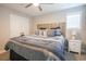 Inviting main bedroom with wood-style headboard, closet, and natural light at 511 Rose Fountain Dr., Myrtle Beach, SC 29579