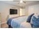 Comfortable main bedroom featuring a large TV and soft blue bedding at 511 Rose Fountain Dr., Myrtle Beach, SC 29579