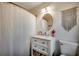 Bright bathroom with vanity and mirror featuring a decorative macrame wall hanging at 5137 Highway 17 Business # 3A, Murrells Inlet, SC 29576