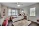 Cozy bedroom featuring stylish decor, plush rug, and plenty of natural light at 5137 Highway 17 Business # 3A, Murrells Inlet, SC 29576