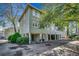 Inviting exterior view of raised beach home featuring ample parking and charming architectural details at 5137 Highway 17 Business # 3A, Murrells Inlet, SC 29576