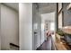 Bright hallway featuring hardwood floors and an open doorway to a light-filled room at 5137 Highway 17 Business # 3A, Murrells Inlet, SC 29576