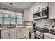 Close-up of the kitchen showcasing countertop space, updated appliances, and stylish backsplash at 5137 Highway 17 Business # 3A, Murrells Inlet, SC 29576