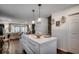 Beautiful kitchen island with marble countertop and pendant lighting open to the living area at 5137 Highway 17 Business # 3A, Murrells Inlet, SC 29576