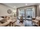 Living room with sliding glass doors opening to outdoor deck at 5137 Highway 17 Business # 3A, Murrells Inlet, SC 29576