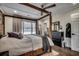 This is a bright main bedroom featuring a four-poster bed and lots of closet space at 5137 Highway 17 Business # 3A, Murrells Inlet, SC 29576