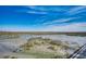 Scenic marsh walk featuring a long wooden walkway stretching across the wetlands under a clear blue sky at 5137 Highway 17 Business # 3A, Murrells Inlet, SC 29576