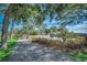 Peaceful walking path with gravel, lush surroundings, and a wooden walkway visible in the distance at 5137 Highway 17 Business # 3A, Murrells Inlet, SC 29576