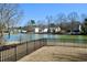 Spacious fenced backyard with tranquil waterfront views provides a serene outdoor living space at 517 Brooksher Dr., Myrtle Beach, SC 29588