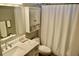 Cozy bathroom with marble countertop, white vanity, and shower with curtain at 517 Brooksher Dr., Myrtle Beach, SC 29588