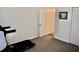 Neutral bedroom featuring carpet, a partially opened door, and space for workout equipment at 517 Brooksher Dr., Myrtle Beach, SC 29588