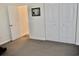 Neutral bedroom featuring carpet and a large closet with bi-fold doors at 517 Brooksher Dr., Myrtle Beach, SC 29588