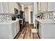 Well-lit kitchen features gray cabinets, tiled backsplash, and modern appliances at 517 Brooksher Dr., Myrtle Beach, SC 29588