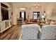 Open-concept living room boasts hardwood floors and views into the dining area at 517 Brooksher Dr., Myrtle Beach, SC 29588