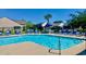 Community pool with blue lounge chairs and tables offers a refreshing oasis for relaxation and socializing at 517 Brooksher Dr., Myrtle Beach, SC 29588