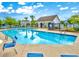 Inviting community pool with lounge chairs and tables offers a perfect spot for relaxation and summer fun at 517 Brooksher Dr., Myrtle Beach, SC 29588