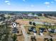 Aerial view of home in neighborhood, nearby golf course and pond at 547 Bucks Trail, Longs, SC 29568