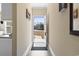 Inviting foyer featuring neutral paint, with a view of the house through the open front door at 547 Bucks Trail, Longs, SC 29568