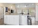 Kitchen island featuring granite countertop, pendant lights, stainless steel dishwasher, and breakfast bar with seating at 547 Bucks Trail, Longs, SC 29568