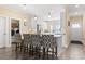 Kitchen featuring bar seating, stainless steel appliances, and white cabinets with sleek hardware at 547 Bucks Trail, Longs, SC 29568