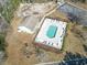 Aerial view of community pool with lounge chairs and cabana at 547 Bucks Trail, Longs, SC 29568