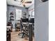 Bedroom featuring a dual monitor workstation, neutral walls, and custom shelving for accessories at 5572 Redleaf Rose Dr., Myrtle Beach, SC 29579