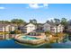 Beautiful aerial view of the condo community, pool, and surrounding lush landscaping at 611 Woodmoor Dr. # 301, Murrells Inlet, SC 29576