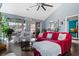 Bright living room featuring a red sofa, wood floors, and a view to the outside at 611 Woodmoor Dr. # 301, Murrells Inlet, SC 29576