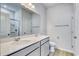 Bathroom with double sinks, a large mirror, grey cabinets, and a separate shower at 620 Mccorkle Place, Conway, SC 29526