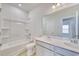 Clean bathroom with double sink vanity, shower, and tub combo and neutral walls at 620 Mccorkle Place, Conway, SC 29526