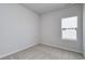 Bright bedroom with neutral carpet, light gray walls, and a window providing natural light at 620 Mccorkle Place, Conway, SC 29526