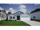 Charming single-story home with blue and gray siding, a well-manicured lawn, and an attached two-car garage at 620 Mccorkle Place, Conway, SC 29526