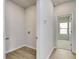 Hallway showing access to laundry room on the left and a bedroom on the right at 620 Mccorkle Place, Conway, SC 29526