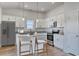 Modern kitchen with white cabinetry, stainless steel appliances, a granite island, and pendant lighting at 620 Mccorkle Place, Conway, SC 29526