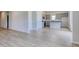 Open floorplan featuring new light wood flooring leading to a modern kitchen at 620 Mccorkle Place, Conway, SC 29526