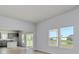 Bright living room featuring light wood flooring, neutral walls, and large windows with water views at 620 Mccorkle Place, Conway, SC 29526