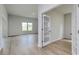Open floor plan showcasing the living room and the office area with french doors and hard wood floors at 620 Mccorkle Place, Conway, SC 29526