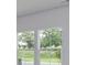 A view from inside the home through the double windows to the green backyard at 620 Mccorkle Place, Conway, SC 29526